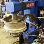 First, we heat up the the damaged alloy wheel so the metal moves without cracking and further damaging the wheel.